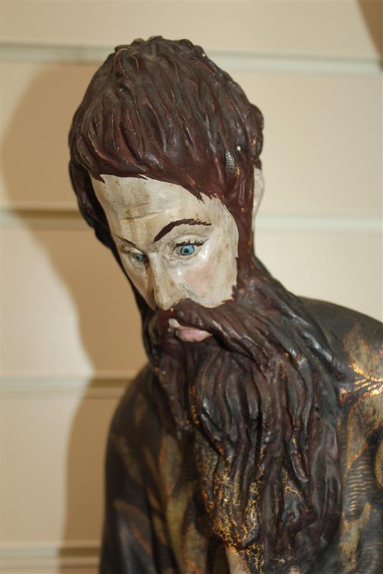 A 20th century carved and polychrome painted figure of a Saint, 31in.